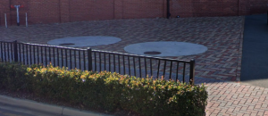 image shows cast-in coverswith pavers around them
