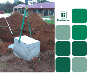 image shows a Ri-Industries concrete septic tank being installed underground